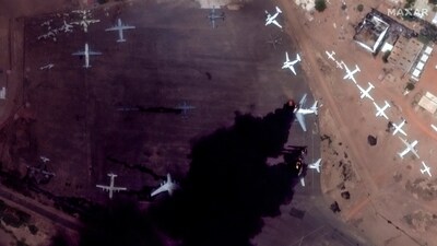 This satellite image provided by Maxar Technologies shows two burning planes at Khartoum International Airport, Sudan, Sunday. (AP) This satellite image provided by Maxar Technologies shows two burning planes at Khartoum International Airport, Sudan, Sunday. (AP)