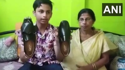 Ankurit Karmakar with the sensor-enabled shoe. (Twitter/ANI) Ankurit Karmakar with the sensor-enabled shoe. (Twitter/ANI)