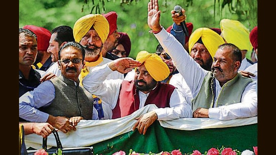 Punjab CM Bhagwant Mann during a roadshow before the nomintion filing of AAP candidate Sushil Kumar Rinku for Jalandhar Lok Sabha bypoll in Jalandhar on Monday. (PTI)