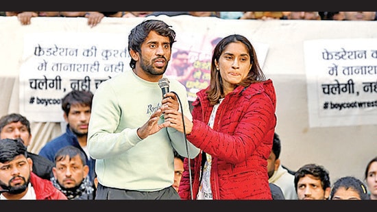 Wrestler Bajrang Punia and Vinesh Phogat speak during a protest against the Wrestling Federation of India (WFI) and its chief Brij Bhushan Sharan Singh, New Delhi (ANI)