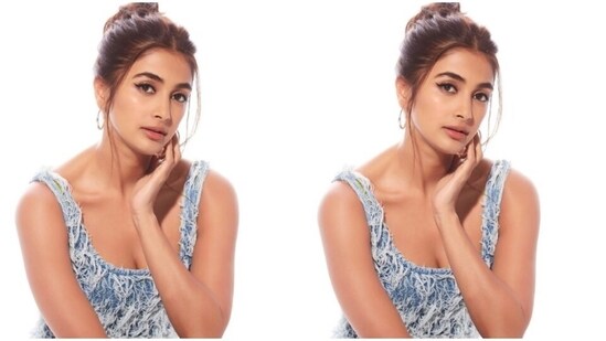 Styled by fashion stylist Ami Patel, Pooja wore her tresses into a clean top bun and left a few strands of hair open around her face.&nbsp;(Instagram/@hegdepooja)
