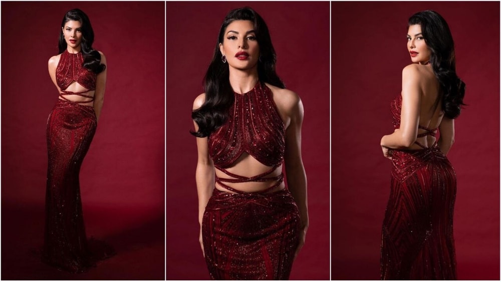 jacqueline fernandez red dress Jacqueline Fernandez dazzles in this stunning embellished maroon cut-out gown : Bollywood News