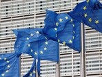 European Union flags flutter outside the EU Commission headquarters in Brussels, Belgium.