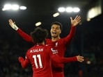 Liverpool's Mohamed Salah celebrates scoring their fourth goal with Cody Gakpo