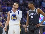 Golden State Warriors guard Stephen Curry (30) and Sacramento Kings guard De'Aaron Fox (5) talk during a timeout during the second half of Game 2 in the first round of the NBA basketball playoffs in Sacramento, Calif., Monday, April 17, 2023. The Kings won 114-106. Golden State Warriors guard Stephen Curry (30) and Sacramento Kings guard De'Aaron Fox (5) talk during a timeout during the second half of Game 2 in the first round of the NBA basketball playoffs in Sacramento, Calif., Monday, April 17, 2023. The Kings won 114-106.