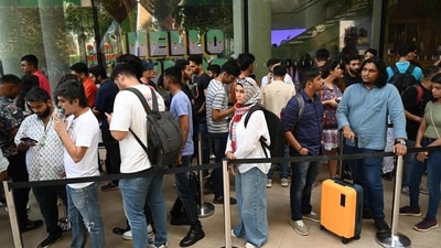 People queue outside India's first Apple store in Mumbai. (AFP) People queue outside India's first Apple store in Mumbai. (AFP)