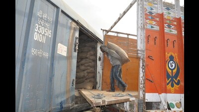 A worker transfers wheat from a truck to a railway coach in Patiala on Tuesday. (HT photo) A worker transfers wheat from a truck to a railway coach in Patiala on Tuesday. (HT photo)