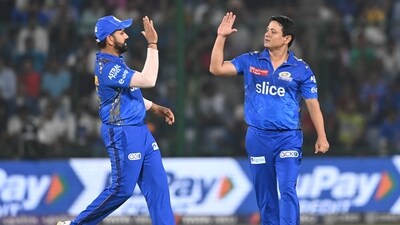 Piyush Chawla celebrates after picking a wicket with Mumbai Indians captain Rohit Sharma (AFP) Piyush Chawla celebrates after picking a wicket with Mumbai Indians captain Rohit Sharma (AFP)