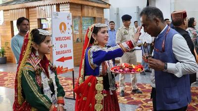 Guests being accorded a welcome as per Himachali tradition on their arrival at Kangra Airport . (HT File) Guests being accorded a welcome as per Himachali tradition on their arrival at Kangra Airport . (HT File)
