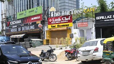 Gurugram, India-April 18, 2023: Gurugram police raided a The Big Tree Cafe at Golf Course road for allegedly serving liquor illegally to the customers without the appropriate license and arrested the two worker, in Gurugram, India, on Tuesday, 28 April 2023. (Photo by Parveen Kumar/Hindustan Times)(Pic to go with Leena Dhankar's story) Gurugram, India-April 18, 2023: Gurugram police raided a The Big Tree Cafe at Golf Course road for allegedly serving liquor illegally to the customers without the appropriate license and arrested the two worker, in Gurugram, India, on Tuesday, 28 April 2023. (Photo by Parveen Kumar/Hindustan Times)(Pic to go with Leena Dhankar's story)