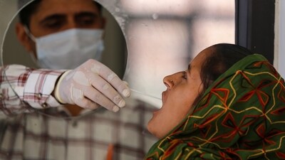Jammu: A healthcare worker collects a swab sample of a woman for Covid-19 test, amid a rise in coronavirus cases in the country, in Jammu, Saturday, April 15, 2023. (PTI Photo)(PTI04_15_2023_000022B) (PTI) Jammu: A healthcare worker collects a swab sample of a woman for Covid-19 test, amid a rise in coronavirus cases in the country, in Jammu, Saturday, April 15, 2023. (PTI Photo)(PTI04_15_2023_000022B) (PTI)
