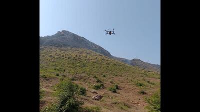 Strict monitoring of the forests atop the Vyohargiri hills is also being conducted by drone cameras, district administration officials said. (Santosh Kumar/HT Photo)