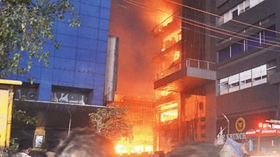 Thane, India - April 18, 2023: Firefighters trying to extinguish a fire caused due to short circuit, at Orion Business Park. Police force, disaster management cell, fire brigade with fire vehicles, rescue vehicles, water tankers and jumbo water tanker vehicles have been pressed into the rescue operation, at Kapurbawdi, in Thane, India, on Tuesday, April 18, 2023. (Praful Gangurde/HT Photo) (HT PHOTO)