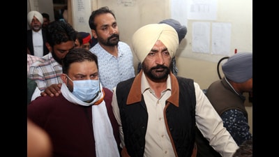 Vigilance Department presented AAP MLA Amit Ratan Kotfatta (with face mask) in court at Bathinda in Punjab on Thursday. (HT Photo)