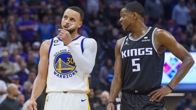 Golden State Warriors guard Stephen Curry (30) and Sacramento Kings guard De'Aaron Fox (5) talk during a timeout during the second half of Game 2 in the first round of the NBA basketball playoffs in Sacramento, Calif., Monday, April 17, 2023. The Kings won 114-106. (AP) Golden State Warriors guard Stephen Curry (30) and Sacramento Kings guard De'Aaron Fox (5) talk during a timeout during the second half of Game 2 in the first round of the NBA basketball playoffs in Sacramento, Calif., Monday, April 17, 2023. The Kings won 114-106. (AP)