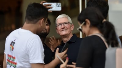Tim cook poses for selfies with customers during the inauguration of the new Apple store. (Bloomberg) Tim cook poses for selfies with customers during the inauguration of the new Apple store. (Bloomberg)