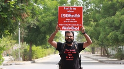 The image shows Kiran Verma holding up a placard to raise awareness about blood donation. (Kiran Verma) The image shows Kiran Verma holding up a placard to raise awareness about blood donation. (Kiran Verma)