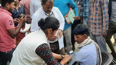 nurse examines a man who allegedly consumed suspected spurious liquor in Motihari on April 16 (PTI File) nurse examines a man who allegedly consumed suspected spurious liquor in Motihari on April 16 (PTI File)