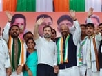 Congress leader Rahul Gandhi with party leaders wave to the supporters during a mega rally at Humnabad, in Bidar 