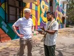 Apple CEO Tim Cook with artist Dattaraj Naik during his visit to the Art District, in New Delhi, Wednesday, April 19, 2023 Apple CEO Tim Cook with artist Dattaraj Naik during his visit to the Art District, in New Delhi, Wednesday, April 19, 2023