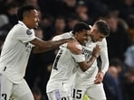 Soccer Football - Champions League - Quarter Final - Second Leg - Chelsea v Real Madrid - Stamford Bridge, London, Britain - April 18, 2023 Real Madrid's Rodrygo celebrates scoring their second goal with Eder Militao and Federico Valverde REUTERS/Dylan Martinez