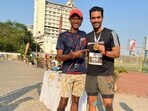 Angad Bedi poses with his coach Brinston Miranada after winning his first silver medal in a 400m race.