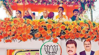 Former Karnataka chief minister BS Yediyurappa during a roadshow in support of his son and BJP leader BY Vijayendra, in Shikaripur on Wednesday. (PTI) Former Karnataka chief minister BS Yediyurappa during a roadshow in support of his son and BJP leader BY Vijayendra, in Shikaripur on Wednesday. (PTI)