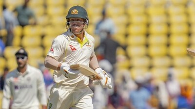 Australia's Marnus Labuschagne, right, and David Warner run between the wickets to score during the third day of the first cricket test match between India and Australia in Nagpur, India, Saturday, Feb. 11, 2023. (AP Photo/Rafiq Maqbool) (AP)