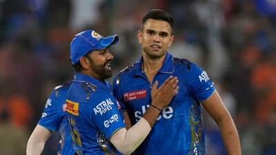 Arjun Tendulkar (R) with Rohit Sharma (AP) Arjun Tendulkar (R) with Rohit Sharma (AP)