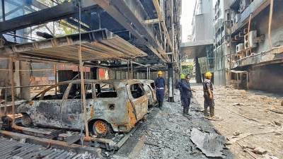 Thane, India - April 19, 2023: Vehicles gutted in the blaze that erupted on Tuesday at Orion Business Park as firemen are seen doing the cooling off operation, at Kapurbawdi, in Thane, India, on Wednesday, April 19, 2023. (Praful Gangurde/HT Photo) (HT PHOTO)