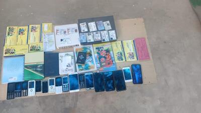 Thte police recovered 67 mobile phones, two tablets, 13 SIM cards, four dongles, seven registry certificates, deeds, 17 debit cards, bank statements, seven vehicles including a Scorpio and a Fortuner, 10 signed blank cheques, 18 cheque books, 28 passbooks, two currency counting machines, and 275 pages related to various transactions from the suspects. (HT Photo) Thte police recovered 67 mobile phones, two tablets, 13 SIM cards, four dongles, seven registry certificates, deeds, 17 debit cards, bank statements, seven vehicles including a Scorpio and a Fortuner, 10 signed blank cheques, 18 cheque books, 28 passbooks, two currency counting machines, and 275 pages related to various transactions from the suspects. (HT Photo)