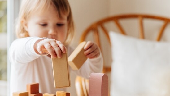 Sensory Bins: Create an interactive sensory bin by filling a large container with sand, water or rice. Add some toy animals, spoons, and cups, and let your kids explore and have fun while developing their fine motor and sensory skills.(Pexels)