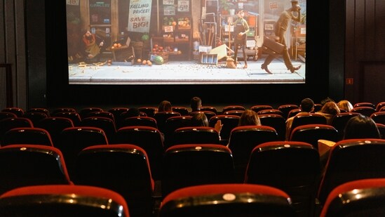 DIY Movie Theater: Create a DIY movie theater in your backyard using a projector and a white sheet. Make some popcorn, provide blankets and pillows, and let your kids enjoy their favorite movies under the stars.(Pexels)