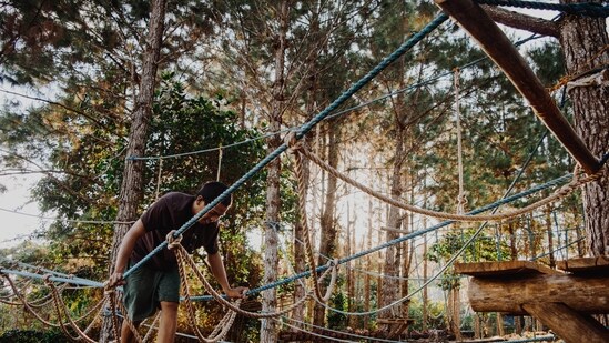 Obstacle Course: Create an obstacle course in your backyard or a park. You can use hula hoops, cones, and jump ropes to create a fun and challenging course. Not only will this activity keep your kids active, but it will also help develop their coordination and agility.(Unsplash)