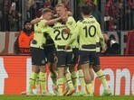 Manchester City's Erling Haaland, centre, celebrates after scoring his side's opening goal during the Champions League quarter final second leg soccer match between Bayern Munich and Manchester City, at the Allianz Arena stadium in Munich, Germany, Wednesday, April 19, 2023. (AP Photo/Matthias Schrader)