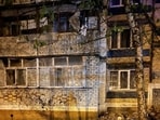 A view shows a damaged apartment block at the accident scene following a large blast in a street in the city of Belgorod, Russia.
