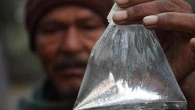 A villager shows a pouch of ’hooch’. (Subhendu Ghosh/ HT File Photo) A villager shows a pouch of ’hooch’. (Subhendu Ghosh/ HT File Photo)