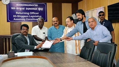 Karnataka CM Bommai, with BJP National President JP Nadda and actor Kichcha Sudeep, files his nomination papers from Shiggaon for the Karnataka Assembly elections on Wednesday. (ANI Picture Service) Karnataka CM Bommai, with BJP National President JP Nadda and actor Kichcha Sudeep, files his nomination papers from Shiggaon for the Karnataka Assembly elections on Wednesday. (ANI Picture Service)