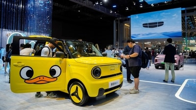 People check a Geely’s Panda mini at the Auto Shanghai show, in Shanghai, China. (REUTERS)