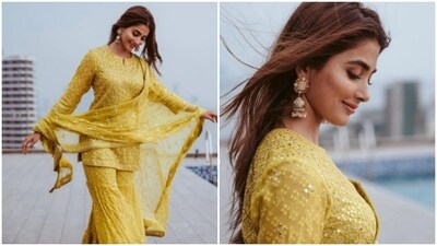 Looking for some fashion inspiration this Eid? Look no further than Pooja Hegde's stunning yellow sharara set! With intricate embroidery in yellow and silver thread, this ensemble is both trendy and elegant. Pair it with some statement jewelry and a bold lip to really make an impression. Whether you're celebrating with family or attending a festive gathering, this outfit is sure to bring some sunshine to your Eid celebrations. (Instagram/@hegdepooja) Looking for some fashion inspiration this Eid? Look no further than Pooja Hegde's stunning yellow sharara set! With intricate embroidery in yellow and silver thread, this ensemble is both trendy and elegant. Pair it with some statement jewelry and a bold lip to really make an impression. Whether you're celebrating with family or attending a festive gathering, this outfit is sure to bring some sunshine to your Eid celebrations. (Instagram/@hegdepooja)