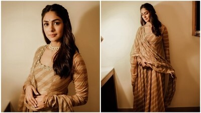 Mrunal Thakur's beige anarkali set is the epitome of elegance and beauty. The stunning dress is adorned with intricate hand-embroidery work, while the dupatta features a dazzling array of mirrors, dabka work, zari, cutdana, sequins, and moti. This outfit is sure to make you feel like a queen on Eid, with its delicate details and understated glamour. (Instagram/@mrunalthakur) Mrunal Thakur's beige anarkali set is the epitome of elegance and beauty. The stunning dress is adorned with intricate hand-embroidery work, while the dupatta features a dazzling array of mirrors, dabka work, zari, cutdana, sequins, and moti. This outfit is sure to make you feel like a queen on Eid, with its delicate details and understated glamour. (Instagram/@mrunalthakur)