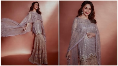 Looking for the perfect outfit inspiration for Eid? Look no further than Madhuri Dixit's dazzling sharara set! With a shimmering silver kurti, cream-colored sharara, and netted kurti, this ensemble is sure to turn heads. Plus, her side-parted curled hair, statement jhumkis, and bold red lipstick add the perfect touch of glamour. (Instagram/@madhuridixitnene) Looking for the perfect outfit inspiration for Eid? Look no further than Madhuri Dixit's dazzling sharara set! With a shimmering silver kurti, cream-colored sharara, and netted kurti, this ensemble is sure to turn heads. Plus, her side-parted curled hair, statement jhumkis, and bold red lipstick add the perfect touch of glamour. (Instagram/@madhuridixitnene)