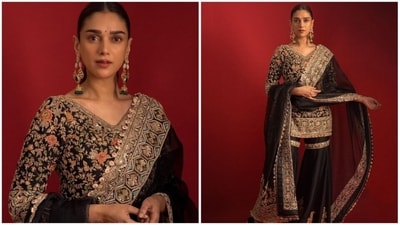 Aditi Rao Hydari's grace and charm are truly enchanting, and she never fails to impress with her elegant traditional outfits. Her stunning black sharara set with heavy embroidery is the perfect Eid outfit for those who want to make a statement. With a unique blend of class and trendiness, this outfit is sure to turn heads and leave a lasting impression. (Instagram/@manishmalhotra) Aditi Rao Hydari's grace and charm are truly enchanting, and she never fails to impress with her elegant traditional outfits. Her stunning black sharara set with heavy embroidery is the perfect Eid outfit for those who want to make a statement. With a unique blend of class and trendiness, this outfit is sure to turn heads and leave a lasting impression. (Instagram/@manishmalhotra)
