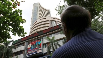A man looks at a screen across a road displaying the Sensex on the facade of the Bombay Stock Exchange (BSE) building in Mumbai, India. (File image) (REUTERS)