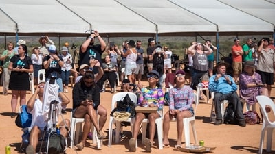 People watch a total solar eclipse at a viewing site 35km from Exmouth, Western Australia. (via Reuters)