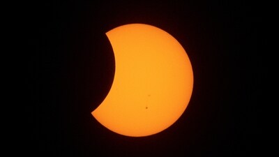 A hybrid solar eclipse view from Metro Manila, Philippines. (Reuters)