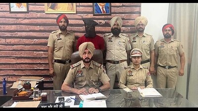 The accused, Karan Kumar, in the custody of police in Ludhiana on Thursday. (HT Photo) The accused, Karan Kumar, in the custody of police in Ludhiana on Thursday. (HT Photo)