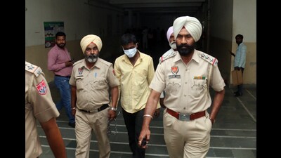 The accused being taken to a Bathinda court on Thursday. (Sanjeev Kumar/HT)