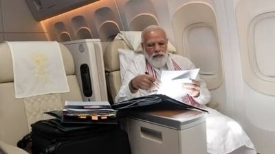File photo of PM Narendra Modi clearing files while travelling on an official visit to the US.