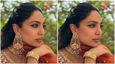 In an orange georgette dupatta with silver embroidery work and zari details at the borders, Sobhita completed her look for the day. (Instagram/@sobhitad) In an orange georgette dupatta with silver embroidery work and zari details at the borders, Sobhita completed her look for the day. (Instagram/@sobhitad)